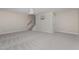 Large basement area with carpeted floor and ceiling fan at 203 Anniston Ct, Cary, NC 27519