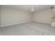Spacious basement with carpeted floor and ceiling fan at 203 Anniston Ct, Cary, NC 27519