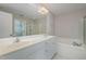 Bathroom with double vanity, soaking tub, and walk-in shower at 203 Anniston Ct, Cary, NC 27519