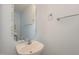 Small bathroom with pedestal sink, mirror, and decorative accents at 203 Anniston Ct, Cary, NC 27519