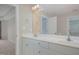 Bright bathroom with double vanity and a large mirror at 203 Anniston Ct, Cary, NC 27519