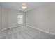 Spacious bedroom with carpeted floor and ceiling fan at 203 Anniston Ct, Cary, NC 27519