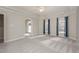 Bright bedroom with carpet, ceiling fan, and access to a second room at 203 Anniston Ct, Cary, NC 27519