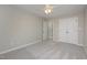 Spacious bedroom with double doors and ceiling fan at 203 Anniston Ct, Cary, NC 27519