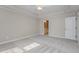 Bedroom with carpet, ceiling fan, and adjacent bathroom access at 203 Anniston Ct, Cary, NC 27519
