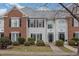 Two-story brick and siding townhouse with a charming front porch at 203 Anniston Ct, Cary, NC 27519