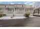 Three-unit townhouse building with garages and snow on the ground at 203 Anniston Ct, Cary, NC 27519