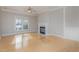 Spacious living room with hardwood floors and fireplace at 203 Anniston Ct, Cary, NC 27519