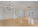 Open concept living room with hardwood floors and stairs at 203 Anniston Ct, Cary, NC 27519