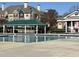 Exterior community pool with a green canopy area for relaxing and swimming laps on a sunny day at 203 Anniston Ct, Cary, NC 27519