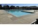 Exterior community pool with swimming lanes on a sunny day, perfect for exercising and relaxing at 203 Anniston Ct, Cary, NC 27519