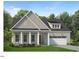 Two-story home with gray siding, white columns, and a two-car garage at 213 Mugby Rd # 171, Raleigh, NC 27610