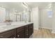 This bathroom features dual sinks, a walk-in shower and a separate room for the toilet at 245 E Webber Ln, Clayton, NC 27527