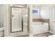 Well-lit bathroom featuring a glass shower and a soaking tub at 245 E Webber Ln, Clayton, NC 27527