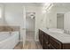 This bathroom features dual sinks and a soaking tub at 245 E Webber Ln, Clayton, NC 27527