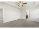 Bright bedroom with a ceiling fan and ensuite bathroom access at 245 E Webber Ln, Clayton, NC 27527