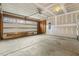 Spacious garage featuring an automatic door, concrete flooring, and unfinished drywall at 245 E Webber Ln, Clayton, NC 27527