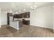 Modern kitchen featuring stainless steel appliances and dark wood cabinets at 245 E Webber Ln, Clayton, NC 27527