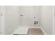 Functional laundry room equipped with shelving and utilities at 245 E Webber Ln, Clayton, NC 27527