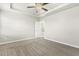 This main bedroom features a ceiling fan and a tray ceiling at 245 E Webber Ln, Clayton, NC 27527