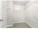 Spacious walk-in closet with built-in shelving for ample storage at 245 E Webber Ln, Clayton, NC 27527