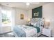 Cozy bedroom with a queen bed and jungle theme decor at 2919 Huxley Way, Apex, NC 27502