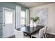 Dining room with a large table and modern artwork at 2919 Huxley Way, Apex, NC 27502