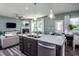 Modern kitchen island with granite countertops and stainless steel appliances at 2919 Huxley Way, Apex, NC 27502