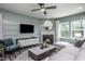 Cozy living room with fireplace and large windows at 2919 Huxley Way, Apex, NC 27502