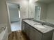 Double vanity bathroom with granite countertops and soaking tub at 395 Magnolia Run Way, Benson, NC 27504
