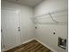 Laundry room with shelving and space for a washer and dryer at 395 Magnolia Run Way, Benson, NC 27504
