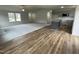Open living space with a mix of hardwood and carpet flooring at 395 Magnolia Run Way, Benson, NC 27504
