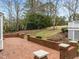 Landscaped backyard with spacious lawn and deck at 4532 Malvern Rd, Durham, NC 27707