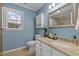 Bathroom features granite countertop, updated vanity, and tiled shower at 4532 Malvern Rd, Durham, NC 27707
