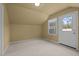 Charming bedroom with carpet, window, and exterior access at 4532 Malvern Rd, Durham, NC 27707