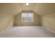 Spacious bedroom with carpet and large window at 4532 Malvern Rd, Durham, NC 27707