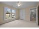 Bedroom with double door closet and view of backyard at 4532 Malvern Rd, Durham, NC 27707