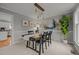 Formal dining room with a wooden table and large artwork at 4532 Malvern Rd, Durham, NC 27707