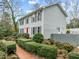 Gray sided home with red door, landscaping and walkway at 4532 Malvern Rd, Durham, NC 27707