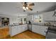Spacious kitchen with white cabinets, granite countertops, and stainless steel appliances at 4532 Malvern Rd, Durham, NC 27707