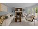 Living room features a cozy fireplace and built-in shelving at 4532 Malvern Rd, Durham, NC 27707