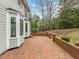 Brick patio with adjacent retaining wall and access to home at 4532 Malvern Rd, Durham, NC 27707