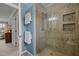 Large shower with glass enclosure and tile surround at 4532 Malvern Rd, Durham, NC 27707