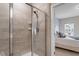 Modern bathroom with a walk-in shower and neutral tile at 505 Great Eno Path, Hillsborough, NC 27278