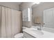 Clean bathroom with white vanity, shower, and toilet at 505 Great Eno Path, Hillsborough, NC 27278
