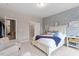 Spacious bedroom with white bed frame and sitting area at 505 Great Eno Path, Hillsborough, NC 27278