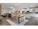 Open concept kitchen and dining area with white cabinets and an island at 505 Great Eno Path, Hillsborough, NC 27278
