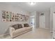 Cozy living area with a sofa and a gallery wall of photos at 505 Great Eno Path, Hillsborough, NC 27278
