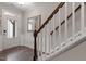 Interior view of a staircase with wooden handrail and hardwood flooring at 505 Great Eno Path, Hillsborough, NC 27278