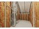 View of the unfinished attic with visible insulation and structural supports at 5110 Chipstone Dr, Raleigh, NC 27610